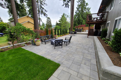 Patio - large contemporary backyard concrete paver patio idea in Seattle