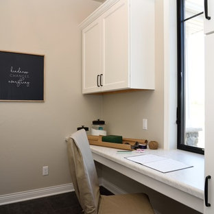 This is an example of a country galley utility room in Milwaukee with recessed-panel cabinets, white cabinets, laminate countertops, grey walls, medium hardwood flooring, brown floors and turquoise worktops.