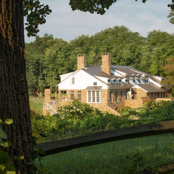 American Farmhouse with Board and Batten and Rustic Stone