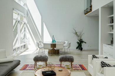 Living room - large contemporary open concept light wood floor living room idea in Chicago with white walls and a bar