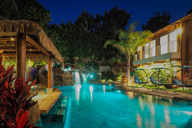 Huge island style pool photo in Los Angeles