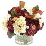 Creative Displays - Assorted Hydrangea with Magnolia Leaves - A beautiful transition piece featuring cream and burgundy hydrangeas and magnolia leaves arranged in a glass vase with whimsical vines and realisitic acrylic water.