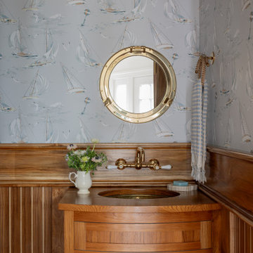 Coastal Powder Room with Nautical Wallpaper