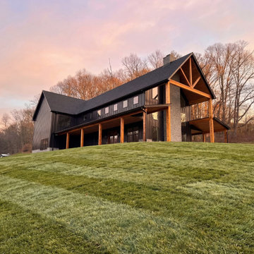 Modern Barn Style New Home Build with Wraparound Porch and Timber Beams