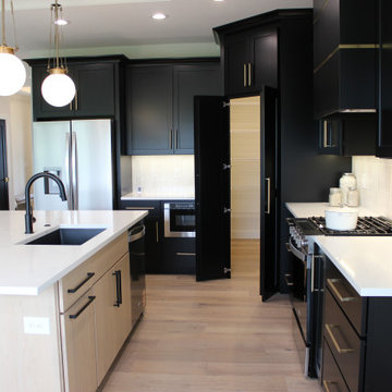Black and Maple Wheat Kitchen with Brass Banded Hood