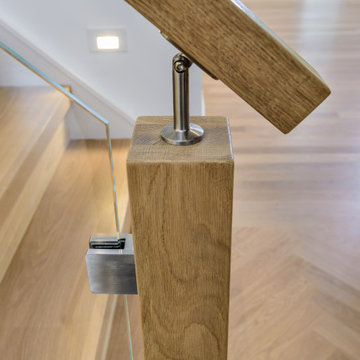 Custom White Oak Staircase with Starfire Tempered Glass Panels