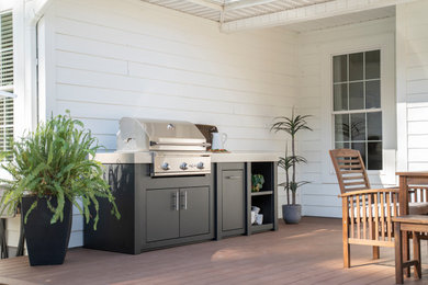 Small minimalist backyard outdoor kitchen deck photo in Other