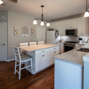 White Shaker Kitchen w/ Pietra Quartz Countertop and Gray Subway Tile Backsplash
