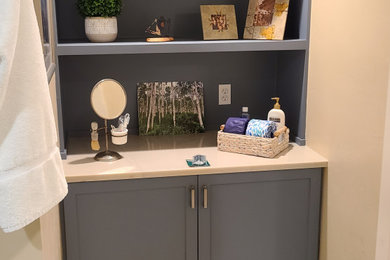 Example of a mid-sized master porcelain tile and beige floor bathroom design in Salt Lake City with shaker cabinets, blue cabinets, a two-piece toilet, beige walls, quartzite countertops and a built-in vanity