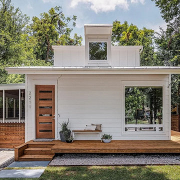 Modern Cottage Entry with Natural Wood Door