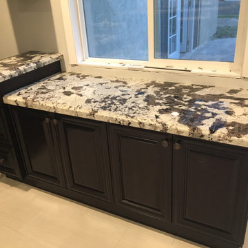 Dark espresso kitchen cabinets with Granite countertop