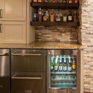 Basement Showing Warm Colors, Straight Lined Cabinets and Stacked Stone