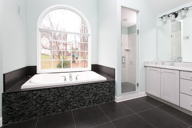 Inspiration for a mid-sized transitional master black tile and glass tile black floor bathroom remodel in DC Metro with gray cabinets, blue walls, an undermount sink, marble countertops, a hinged shower door and shaker cabinets