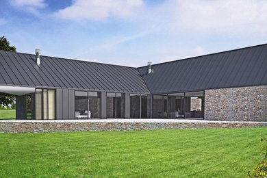 Minimalist one-story stone house exterior photo in San Francisco with a hip roof and a metal roof