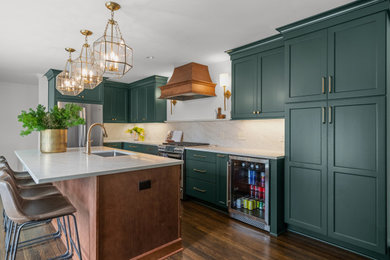 Eat-in kitchen - large transitional medium tone wood floor eat-in kitchen idea in Birmingham with an undermount sink, flat-panel cabinets, green cabinets, marble countertops, white backsplash, marble backsplash, stainless steel appliances, an island and white countertops