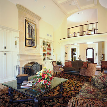 Two Story Living Room with Floor To Ceiling Limestone Fireplace and Second Floor