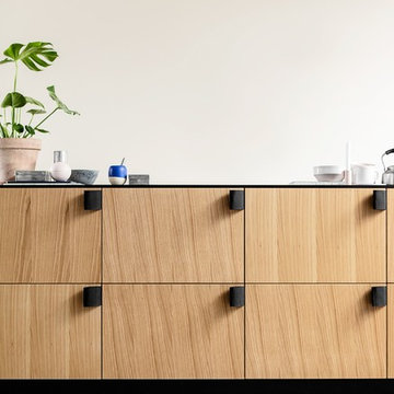 white oak veneer kitchen with black accents