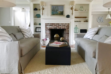 Example of a mid-sized beach style formal and open concept medium tone wood floor living room design in Chicago with gray walls, a standard fireplace and a brick fireplace