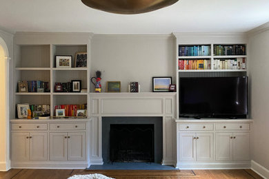 Example of a mid-sized minimalist open concept light wood floor family room library design in New York