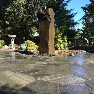 Chocolate Charcoal Quartzite Flagstone Patio with Basalt Column Fountain