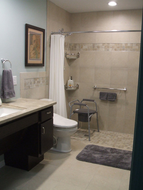 Two curbless showers or shower and bathtub