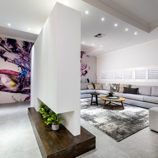 Inspiration for a medium sized contemporary open plan home cinema in Perth with white walls, terracotta flooring, a projector screen and grey floors.