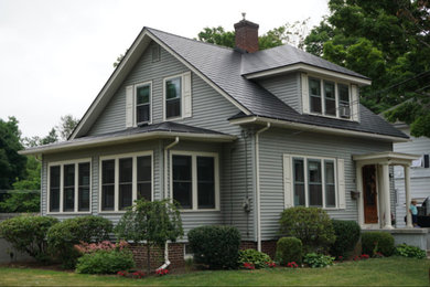 Inspiration for a mid-sized timeless two-story exterior home remodel in Boston with a metal roof