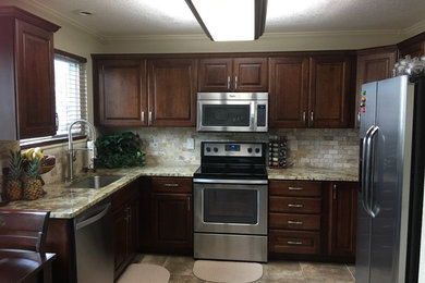 Mid-sized elegant u-shaped kitchen photo in Denver with no island