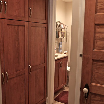 Warm Wood Kitchen Remodel | Angled Granite Island & Integrated Display Cabinets