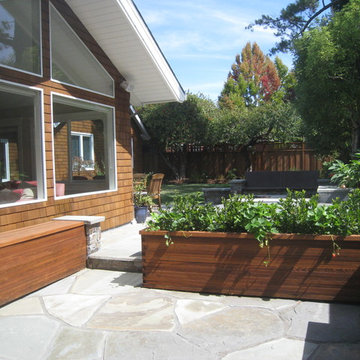 Recycled deck-boards become new planting beds, storage & potting bench