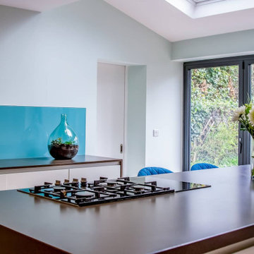 A Contemporary Grey Kitchen with Vibrant Blue Accents