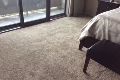 Inspiration for a large transitional master carpeted and brown floor bedroom remodel in Phoenix with beige walls and no fireplace