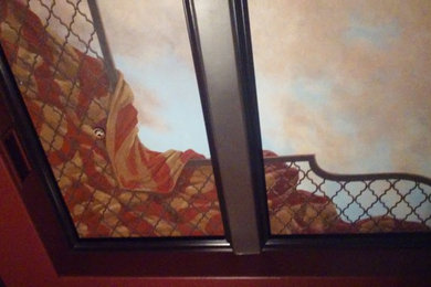 Mural of Moroccan sunset on coffered ceiling in home theater