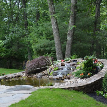 Pond with Bluestone Patio and Pennsylvania Flat Wall