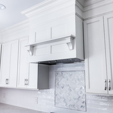 White Hood and Mosaic Backsplash Feature