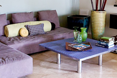 Example of a large minimalist loft-style travertine floor and beige floor family room design in Phoenix with blue walls, no fireplace and a concealed tv