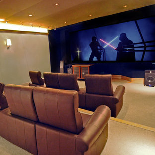 Inspiration for a medium sized traditional enclosed home cinema in Manchester with grey walls, carpet, a projector screen and beige floors.
