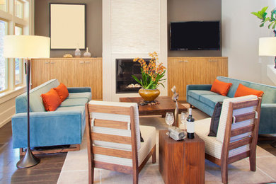 Mid-sized trendy open concept dark wood floor family room photo in New York with beige walls, a standard fireplace, a stone fireplace and a media wall