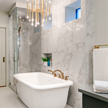 Glamourous tub with chandelier above