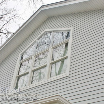 Petagon Andersen Window with White Trim & Light Mist Hardie 4" Lap Siding