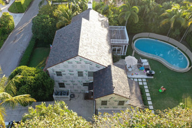 Large transitional white two-story concrete fiberboard exterior home idea in Other