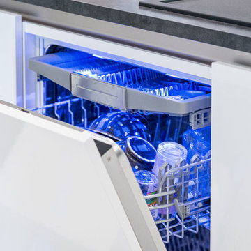 Cuisine SieMatic design en laque blanche avec un îlot central