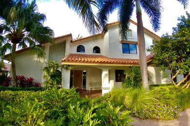 Mid-sized elegant white two-story stucco gable roof photo in Miami