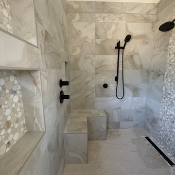 Curd-less walk-in shower; heated floors in bathroom + shower+bench LED