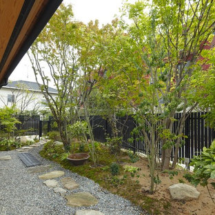 福岡のアジアンスタイルのおしゃれな庭 (デッキ材舗装、日向) の写真
