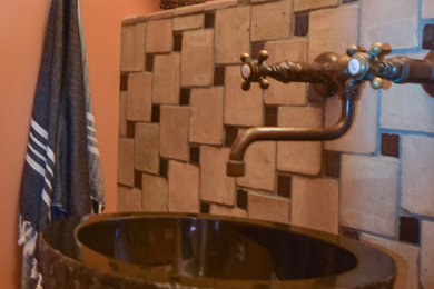 Arts and crafts ceramic tile and beige floor bathroom photo in Other with open cabinets and a vessel sink