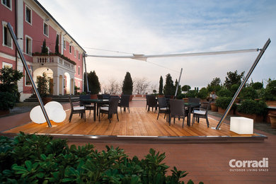 Mid-sized backyard deck photo in Indianapolis with an awning