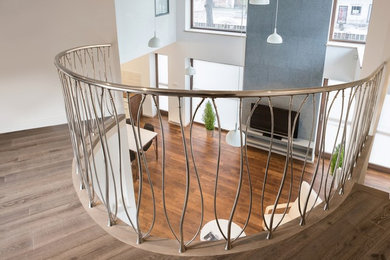 Design ideas for a large contemporary staircase in Paris with metal railing.
