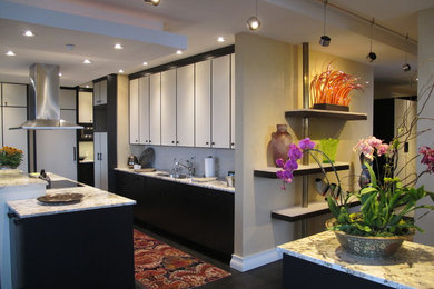 Inspiration for a mid-sized modern galley dark wood floor eat-in kitchen remodel in Minneapolis with white backsplash, glass tile backsplash, an undermount sink, flat-panel cabinets, distressed cabinets, tile countertops, paneled appliances and an island