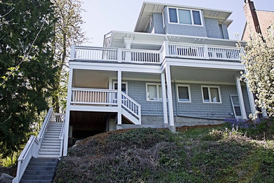 Inspiration for a large craftsman blue two-story wood exterior home remodel in Seattle